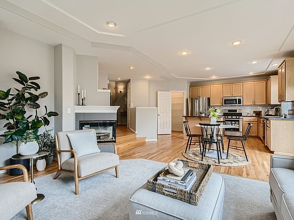 Down the hall opens to this generous open living space and sunny backyard 