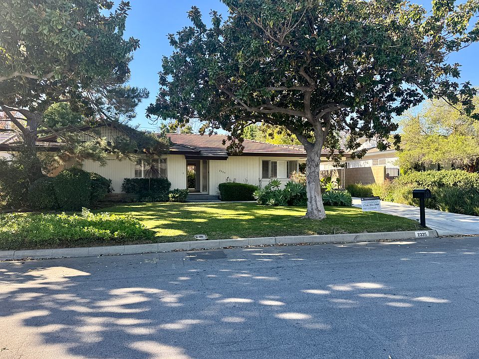 Well-maintained single-story Arcadia home with mature trees, wide lawn, and classic curb appeal. Peaceful residential setting with mature trees and a spacious lot. Desirable address - 2335