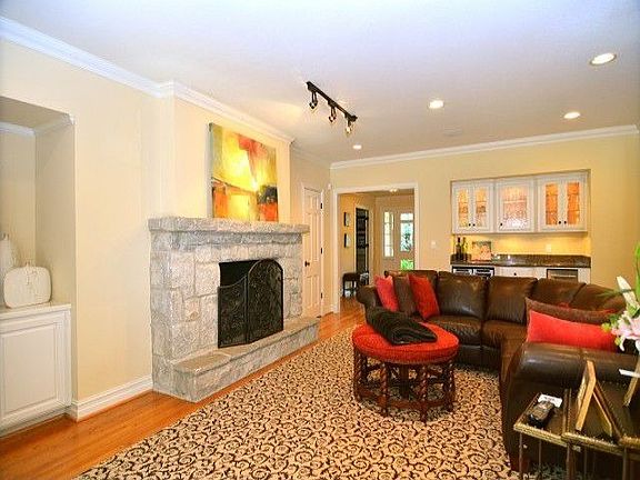 Family room off kitchen with wet bar and wine fridge