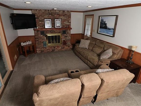 Relax with the family and enjoy your favorite shows, or cozy up to the warm raised hearth fireplace this winter.  Sliding doors 