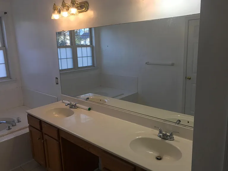 Two sink faucets in master bathroom
