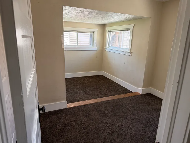 Bedroom upstairs with two bedrooms downstairs with washer and dryer