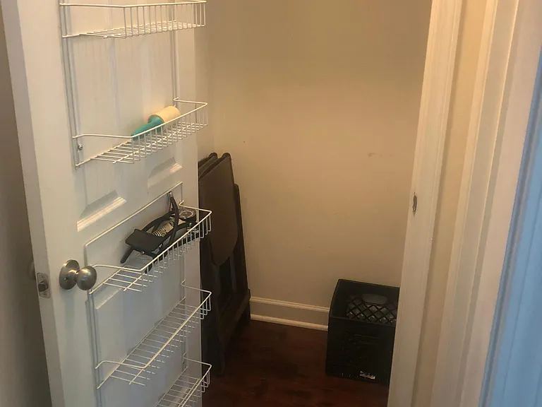 Coat closet has ample storage space, as well as extra foldable chairs.