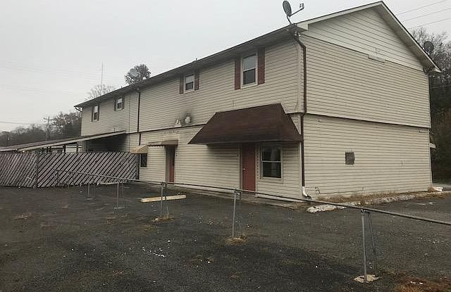 back of the apartment, bottom right corner unit, backdoor into the kitchen.