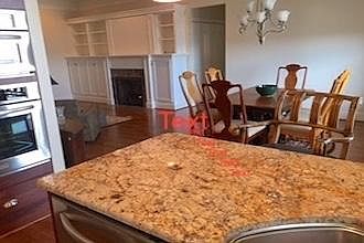 View from Kitchen to Great Room and Fireplace