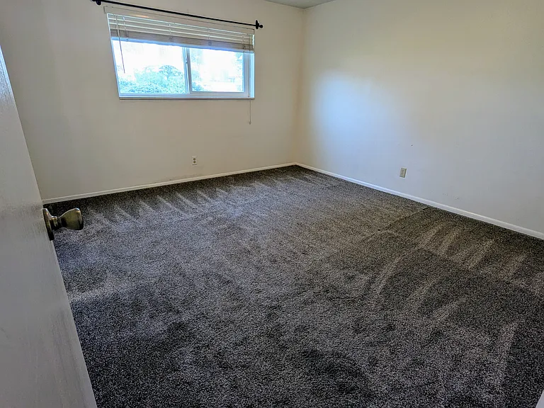 Master bedroom with walk in closet & half bathroom