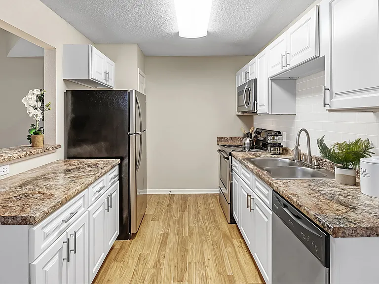 Savor the elegance of our spacious galley kitchens boasting ample cabinetry and abundant counterspace.