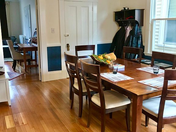 Dining room looking at living room and main entrance door
