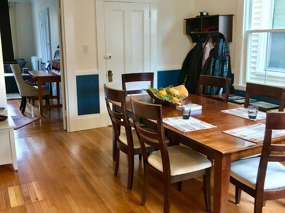 Dining room looking at living room and main entrance door