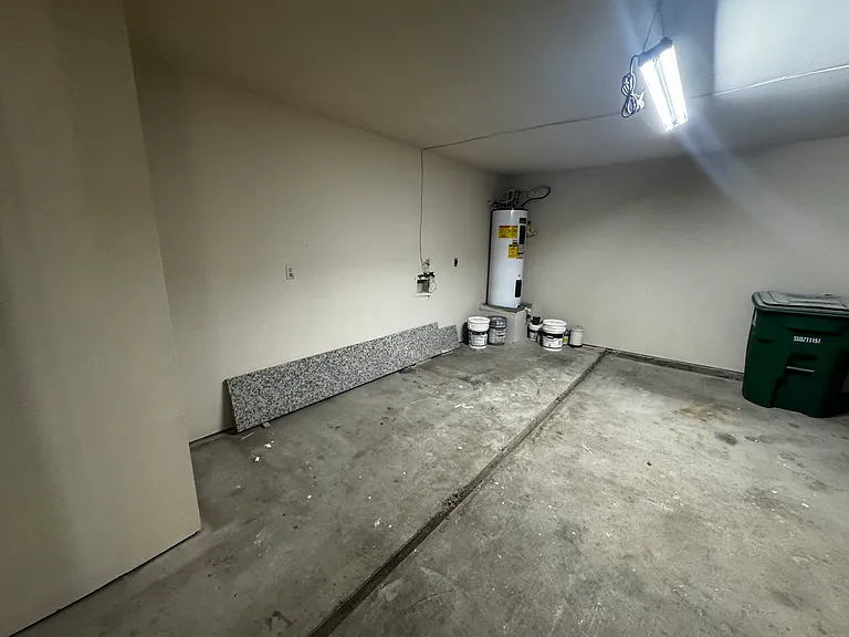 Pic which shows extra storage area. Also area where the washer/dryer connections are located.