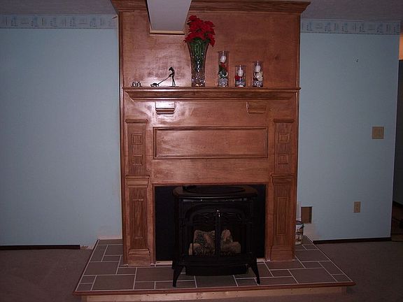 Custom built fireplace in lower level