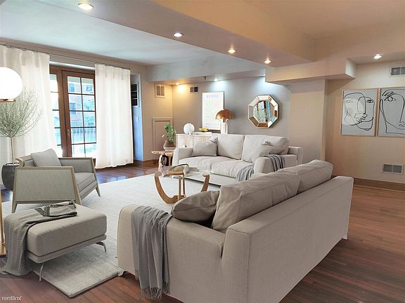 Spacious and bright living room with view of balcony