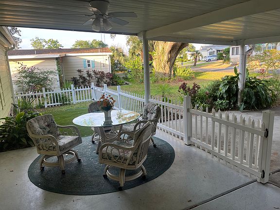 Front sitting area with ceiling fan.