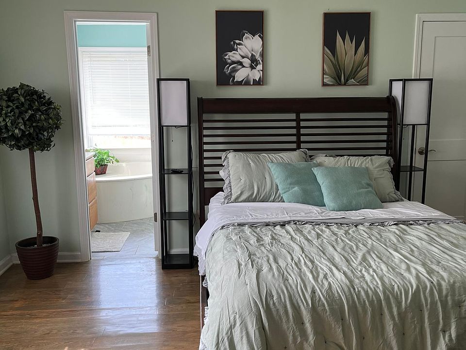 Garden room with private entry, sun room, walk in closet, full bathroom with view of the silver comet trail in large garden tub and walk in shower