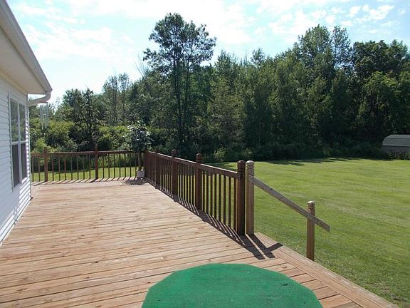 Large wrap around deck off the back of home.