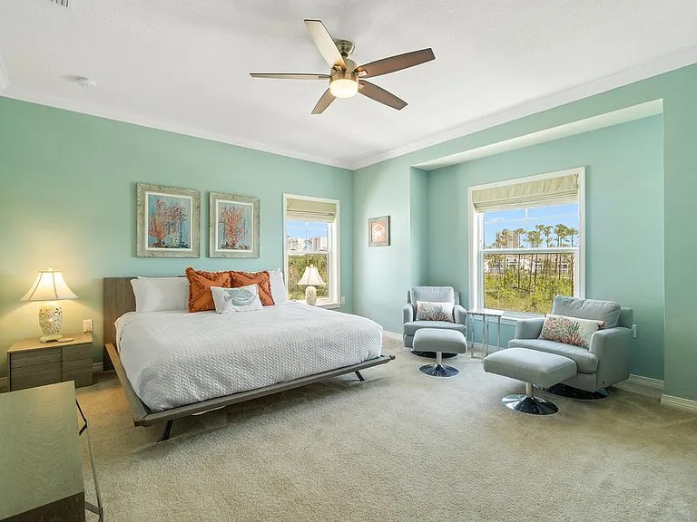 Large primary bedroom with king size bed and walk-in closet.