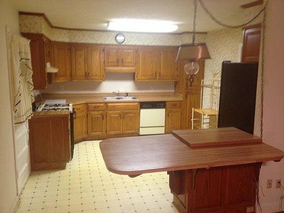 Kitchen photo is old. It has been painted, new tile installe