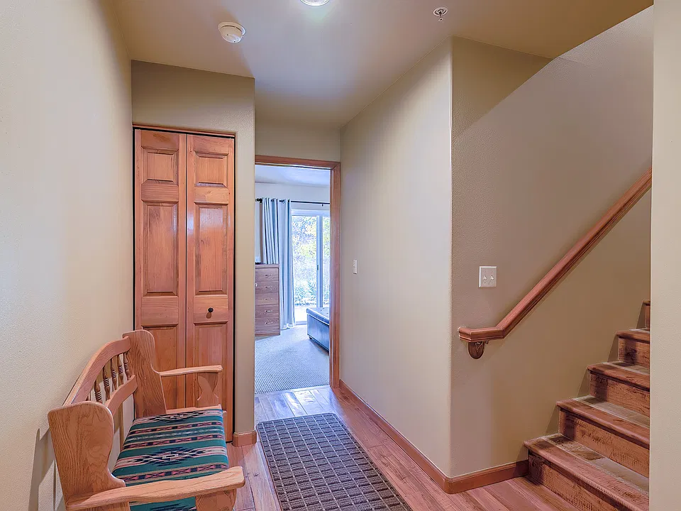Stairs to middle level and first floor bedroom at back