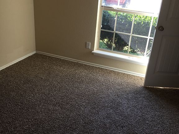 Front bedroom, looks out to the front yard. All closets are