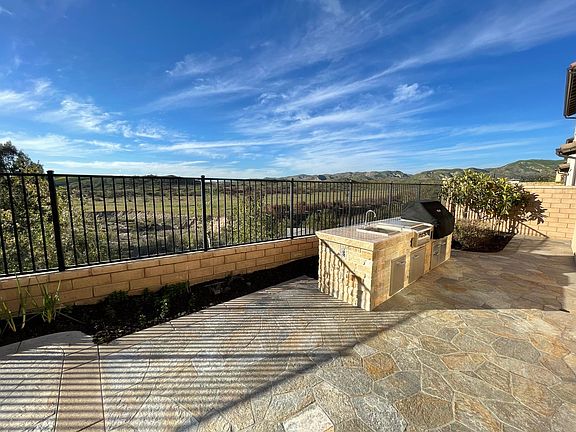 Backyard with bbq grill looking at the Saddleback Mountains.