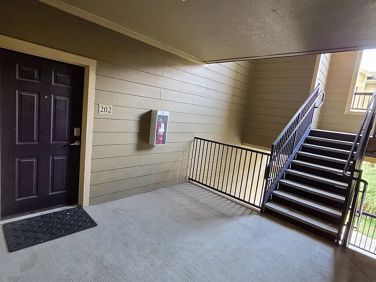 2nd floor landing to the condo-- plenty of space for packages delivered and breathing room.