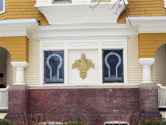 Original stained glass windows and private porch for relaxing.