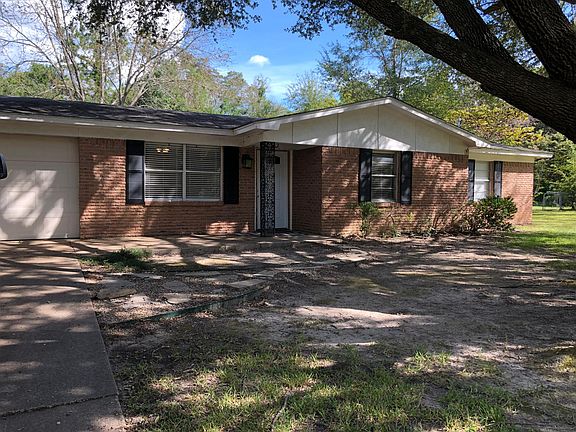 Pleasant home set back from the street, large shade tree and plenty of off street parking on a large lot.