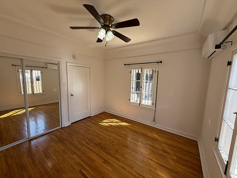 Primary Bedroom with Ceiling Fan Lighting