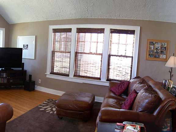 barrel vault ceiling in large living room with large window 