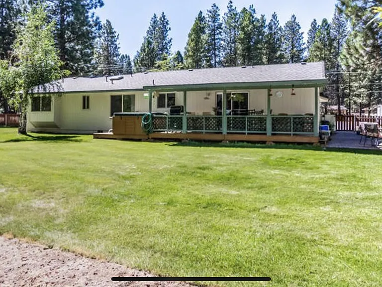 looking from backyard to house. lots of grass!