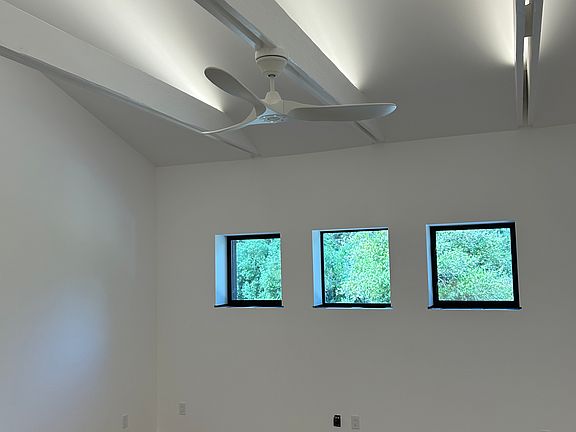 West elevation and beams with uplighting