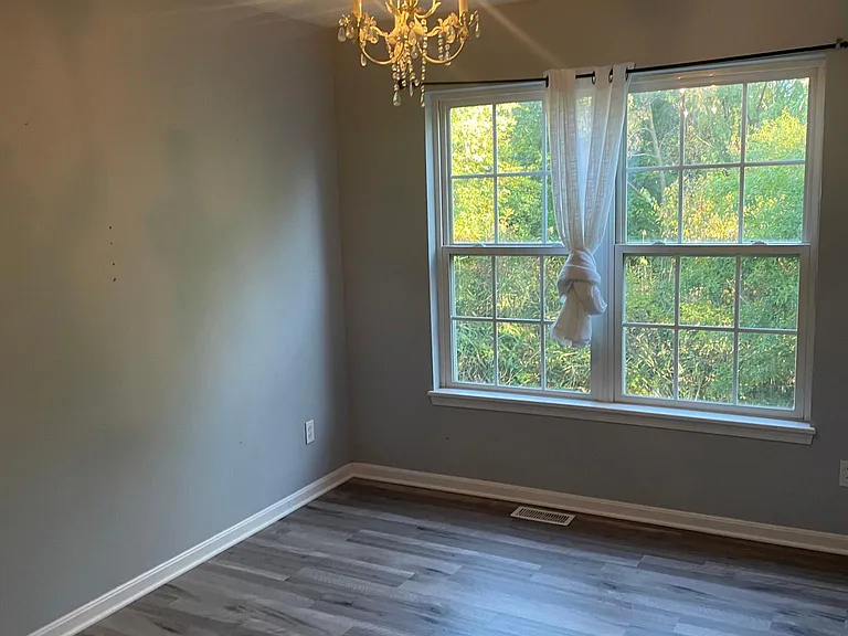 Second Bedroom with decorative Chandelier.