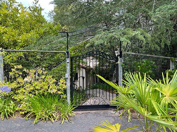 The house is behind this gate and down some stairs.