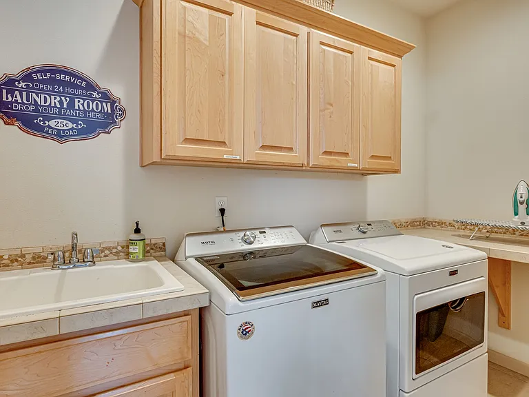 Featuring a large utility sink and folding counter