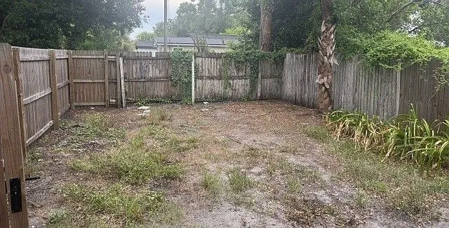 Large fenced back yard pet paradise