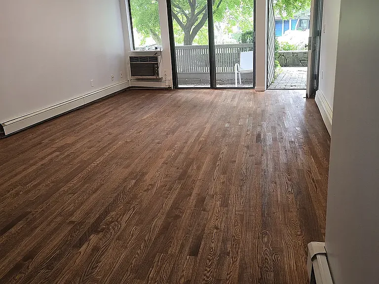 Livingroom leading to outdoor patio overlooking the pond.