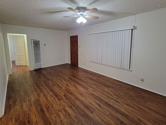 Living room looking towards entry door.