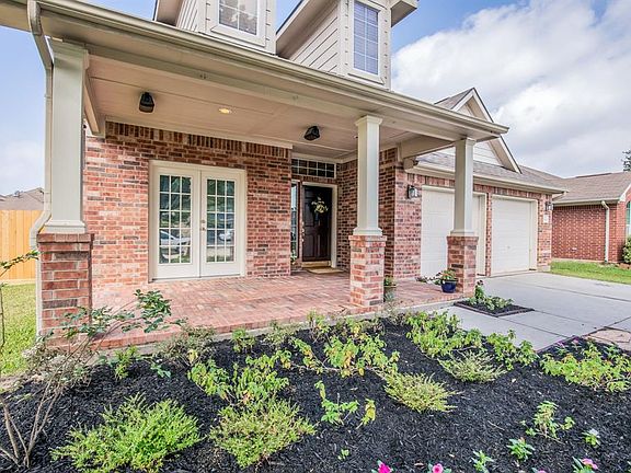 Front porch with brick pavers $$$. Note the lovely french doors leading out from the dining room and speakers to enjoy your favorite tunes.
