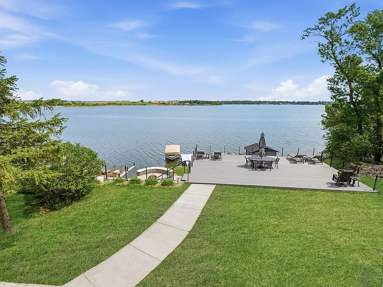 Lake view over the expansive composite deck from up above on the upper level deck.