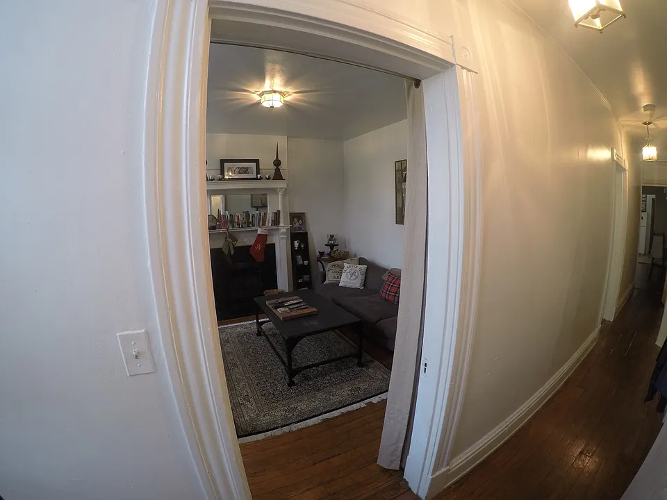 First door, living room.
