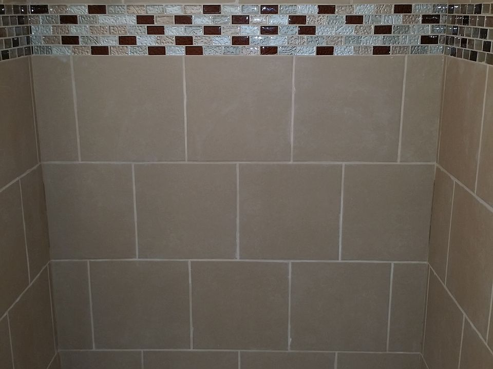 Newly re-tiled bath/shower