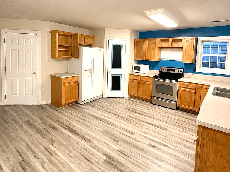 Kitchen with large pantry and door to garage
