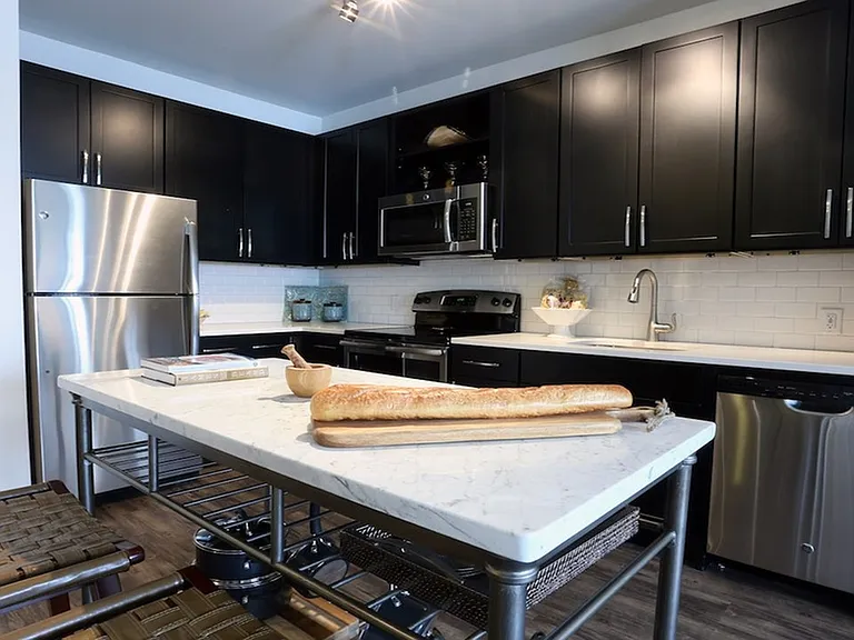 Modern kitchens with stainless steel appliances and moveable islands