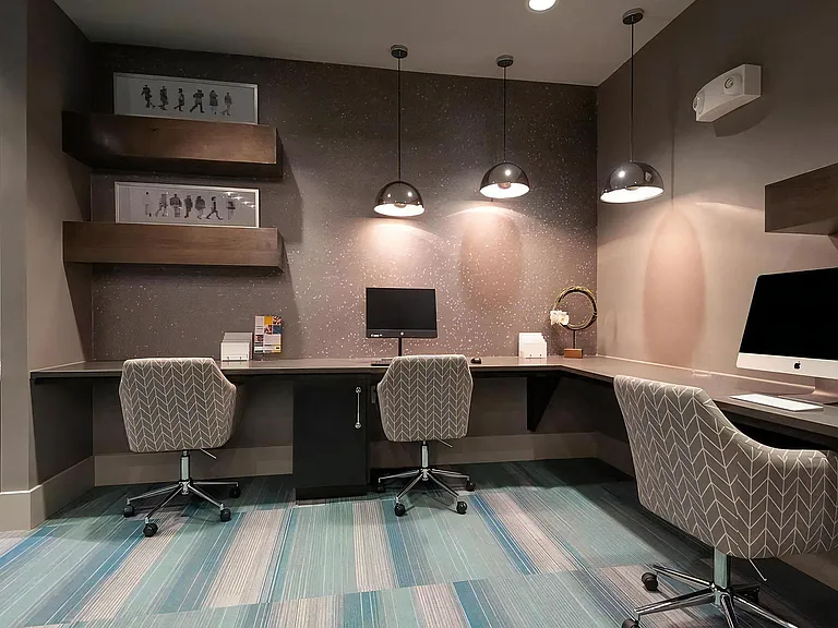 Business Center at Domain at The Gate Featuring Workstations and Modern Lighting
