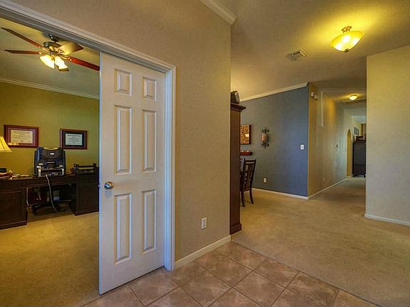 The study has french doors and can easily be used as a game room.