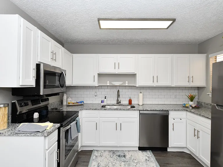 Kitchen area with ample cabinetry & counter space