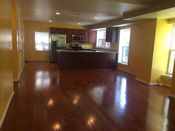 Open concept flows from living room to kitchen