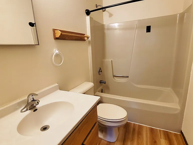 Full bathroom has a tub/shower combo