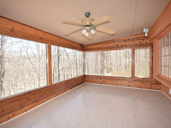 Panoramic view from sunroom of pool and woods all seasons, winter wonderland, spring blooms summer green shade and autumn Orange, Red, Gold and Browns!