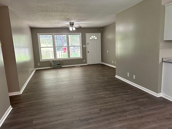 Well lit living room and dinning room